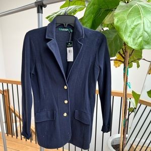 Navy blue blazer with gold buttons and tags